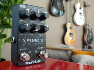 Neunaber Neuron Gain pedal on a red table